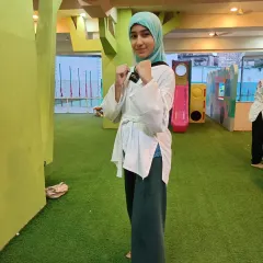 A smile of confidence from one of our students. Taekwondo doesn't just build physical strength; it builds self-esteem.