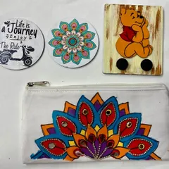 This is just a small sample of the wonderful things kids create in our camps. Here you can see a hand-painted pouch, custom coasters, and a wooden key holder.