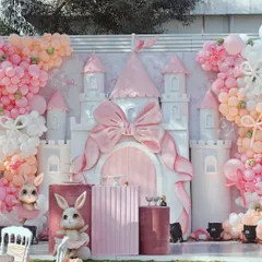 For a truly enchanting celebration, we designed this fairytale bunny and castle theme. The centerpiece is a custom-built castle with a large pink bow, surrounded by plush bunnies, elegant pedestals, and a soft pastel balloon arrangement, creating a magical photo opportunity for a first birthday or baby shower.