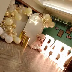 For this baby shower, we added large, light-up 'BABY' marquee letters to the 'Oh Baby' theme. This image shows how the letters add another layer of decoration and create a fantastic photo opportunity for the parents-to-be.