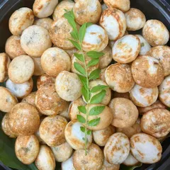 Freshly made Paniyaram, a classic South Indian snack, served as part of a special Sunday meal. I love using authentic recipes and fresh ingredients to bring comforting and delicious food to your family table.