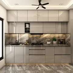 A sleek, modern kitchen with glossy grey cabinets, a marble-patterned backsplash, and integrated under-cabinet lighting for a bright and sophisticated workspace.