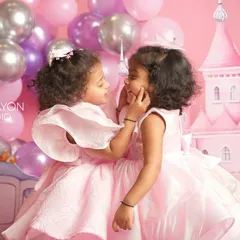 A gentle touch and a shared secret between sisters. Even in a highly themed session, I look for the quiet, authentic moments that reveal the true relationship between siblings.