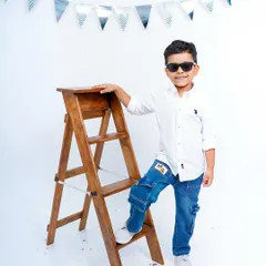 Five years old and full of style! This young man is rocking his sunglasses for his fifth birthday studio portrait.