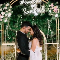 A romantic moment under a personalized neon sign. We love incorporating unique decor elements into our couple portraits to make them even more special and reflective of your day.