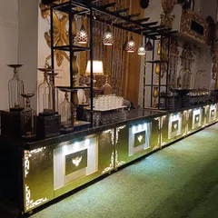 Another angle of our signature black and gold illuminated buffet counter. The modular design allows us to configure the setup to fit any venue space perfectly.