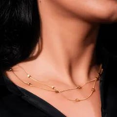 A detailed close-up of the same necklace, focusing on the texture of the chains and beads. Macro shots like this are essential for showcasing product quality.