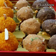 A close-up of our assorted ladoo box, perfect for corporate gifting during Diwali. This box features a variety including classic Motichoor, rich Besan, and wholesome Atta Pinni, each made with distinct flavors and textures.