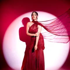 This flowing red gown makes a powerful statement with its asymmetrical neckline and dramatic silhouette. I styled this look for maximum impact, perfect for a cocktail evening or a red-carpet-themed wedding event.