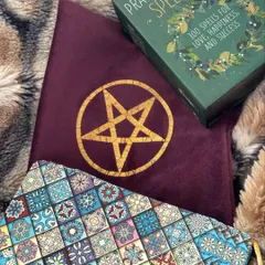 This is where the magic is stored. My tarot pouch, along with a special spell book, keeps my decks safe and charged. The pentacle symbol offers protection and connection to the elements.