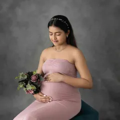 Simple, elegant, and timeless. A classic studio portrait against a textured grey backdrop allows your beautiful bump and radiant glow to be the complete focus of the image.