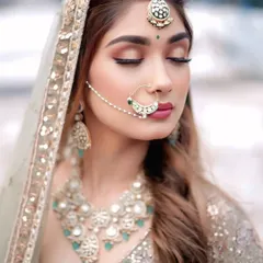 A beautiful shot focusing on the bridal nath and choker. Renting allows you to wear heavy, statement jewellery without the high cost.