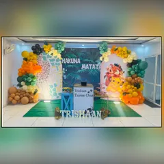 Hakuna Matata means no worries, and that's what I deliver with this Lion King theme. This setup for Trishaan's first birthday includes a jungle backdrop, character cutouts of Timon and Pumbaa, and balloon arches in earthy tones to bring the Pride Lands to your party.