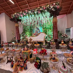 A traditional baby shower (Seemantham) with a touch of grandeur. We created a beautiful stage with a Lord Krishna backdrop, hanging floral strings, and an elaborate display of traditional offerings, making it a truly divine and memorable celebration for the family.