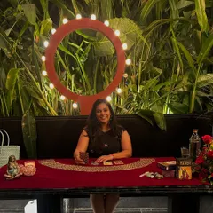 Here I am, set up for a wonderful Family Day event for Accel. It brings me so much joy to bring tarot to corporate gatherings, creating a unique space for insight and connection. My setup includes my cards, crystals, and a little statue of Mother Earth to keep us grounded.