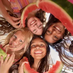 Capturing the pure joy of childhood for a commercial campaign is about creating a fun atmosphere. This shot, taken from a low angle, is all about genuine smiles and summer vibes, making the final image feel authentic and full of life.