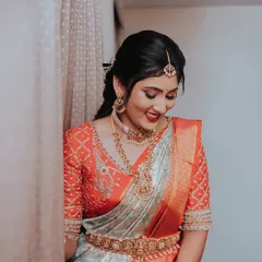 A candid moment of a bride's shy smile. These unposed, in-between moments often result in the most beautiful and authentic bridal portraits.