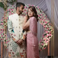 For the groom who wants something truly unique. This client looks incredible in our off-white sherwani featuring a modern peacock and deer motif, proving that traditional wear can be a canvas for artistry.