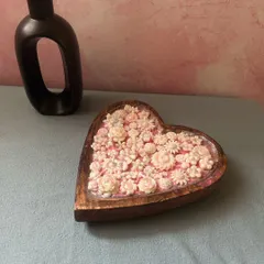 Another angle of the heart dough bowl candle, showing the intricate detail of the hand-placed wax flowers. Each one is a little different, making your candle truly unique.