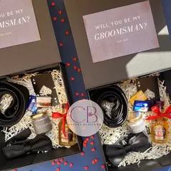 Why should girls have all the fun? We believe the groom's crew deserves to be celebrated too. We launched these "Will you be my Groomsman?" boxes, each packed with a tie, bow tie, a miniature drink, and other essentials to suit up for the big day.