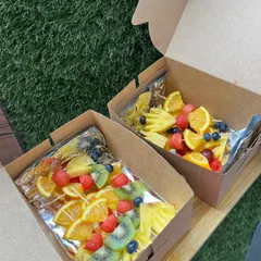 Fresh fruit skewers packed and ready for a party. We use a colorful mix of pineapple, watermelon, kiwi, oranges, and berries to create these refreshing and healthy treats.