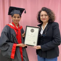 Presenting a CIBTAC certificate to a deserving graduate. We ensure every student receives the guidance needed to succeed in these rigorous international exams.