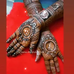A close-up of the bride and groom portraits within a circular frame. This style allows the faces to be the central focus, surrounded by intricate patterns.