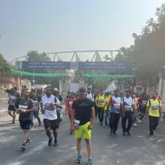 Running towards the entrance of Jawaharlal Nehru Stadium. The energy of a marathon day is unmatched. I train my students to be ready for this level of competition.