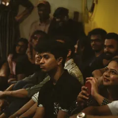 The audience captivated during an electrifying artist session. These events bring live music and learning together.
