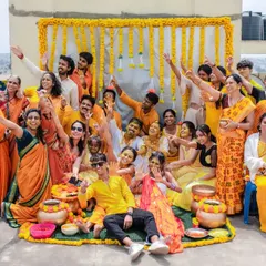 A fantastic group photo from a rooftop Haldi ceremony. We love capturing the collective joy and celebration of all your loved ones together.