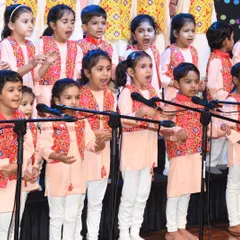 Our youngest performers, singing their hearts out on stage. The discipline and joy they exhibit is a result of months of dedicated practice.
