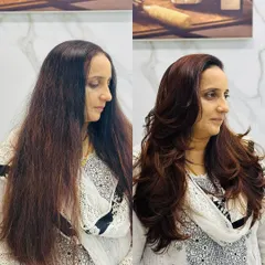 This client wanted a total refresh. I took her long, one-dimensional hair and gave it life with a rich new color and a layered haircut that adds volume and shape.
