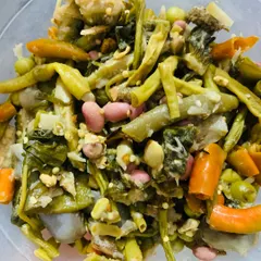 A bowl of Rosop, a traditional Naga stew cooked with different vegetables in bamboo shoot juice.