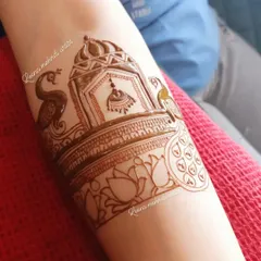 The completed heavy startup design, now with peacocks, lotuses, and detailed shading. This shows the progression from a simple outline to a finished, intricate piece.
