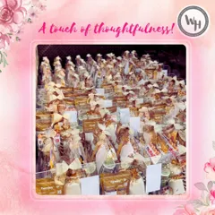 A display of dozens of hampers wrapped and ready for a bulk order. This image demonstrates my capability to handle large volumes with a touch of thoughtfulness, ensuring each gift is perfectly presented.