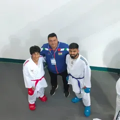 With two of my dedicated students. My goal is to be more than a coach; it is to be a mentor who inspires them to be their best, inside and outside the dojo.