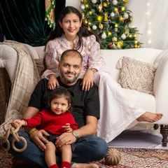 A beautiful family portrait by the Christmas tree. I love capturing these quiet, happy moments with parents and their children during the holiday season.