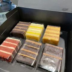 A look inside our Cake Slices Box. This selection includes a variety of our most loved flavours, from rich chocolate to classic red velvet.