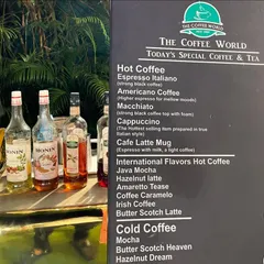The extensive coffee and tea menu, featuring everything from classic Espresso Italiano to flavored lattes and cold coffees.