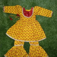 This traditional yellow printed outfit is a sharara set for a nine-month-old baby. I use soft cotton fabrics for my ethnic wear for infants to ensure they stay comfortable during festive occasions.