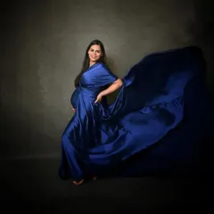 Another look at how a fabric toss can create a stunning effect. This flowing blue satin gown is a favorite from my studio wardrobe for creating dramatic pregnancy portraits.
