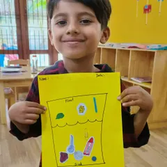This young scientist proudly displays his float and sink activity chart. We use worksheets to help solidify the practical knowledge gained from experiments.