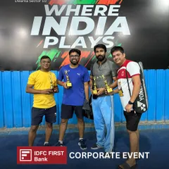 The champions of the corporate badminton tournament holding their trophies. We provide a complete event experience, including awards for the winners.