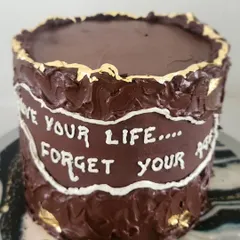For the true dark chocolate lover, this cake is layered with ganache and coated with even more rustic, thick dark chocolate on the outside. The handwritten message makes it a perfect, personal birthday cake.