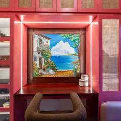 A detailed view of the coastal mural, framed perfectly within the custom cabinetry. The integrated lighting highlights the artwork, making it a captivating feature day or night.