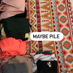The "Maybe Pile" is for items you're unsure about. We'll assess these pieces together to see if they can be altered or styled in a new way to earn a place in your wardrobe.