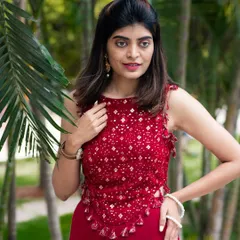 An outdoor portrait that feels vibrant and full of life. The natural setting and confident pose make this a great shot for a social media update.