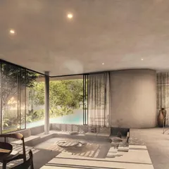 In the "House of Veils," a sunken conversation pit is situated next to floor-to-ceiling glass, looking out onto the pool and garden. This design creates an intimate social space that feels completely integrated with the exterior landscape.