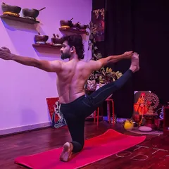 A variation of Vyaghrasana, or Tiger Pose, that deepens the backbend and opens the shoulders. This posture builds strength in the spine and improves balance, all while surrounded by the calming energy of my studio.