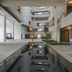 The central atrium at Parkside Retirement Homes is the heart of the community. We designed this multi-story space with a large skylight and indoor landscaping to bring in natural light and create visual connections between floors, fostering a sense of openness and interaction.